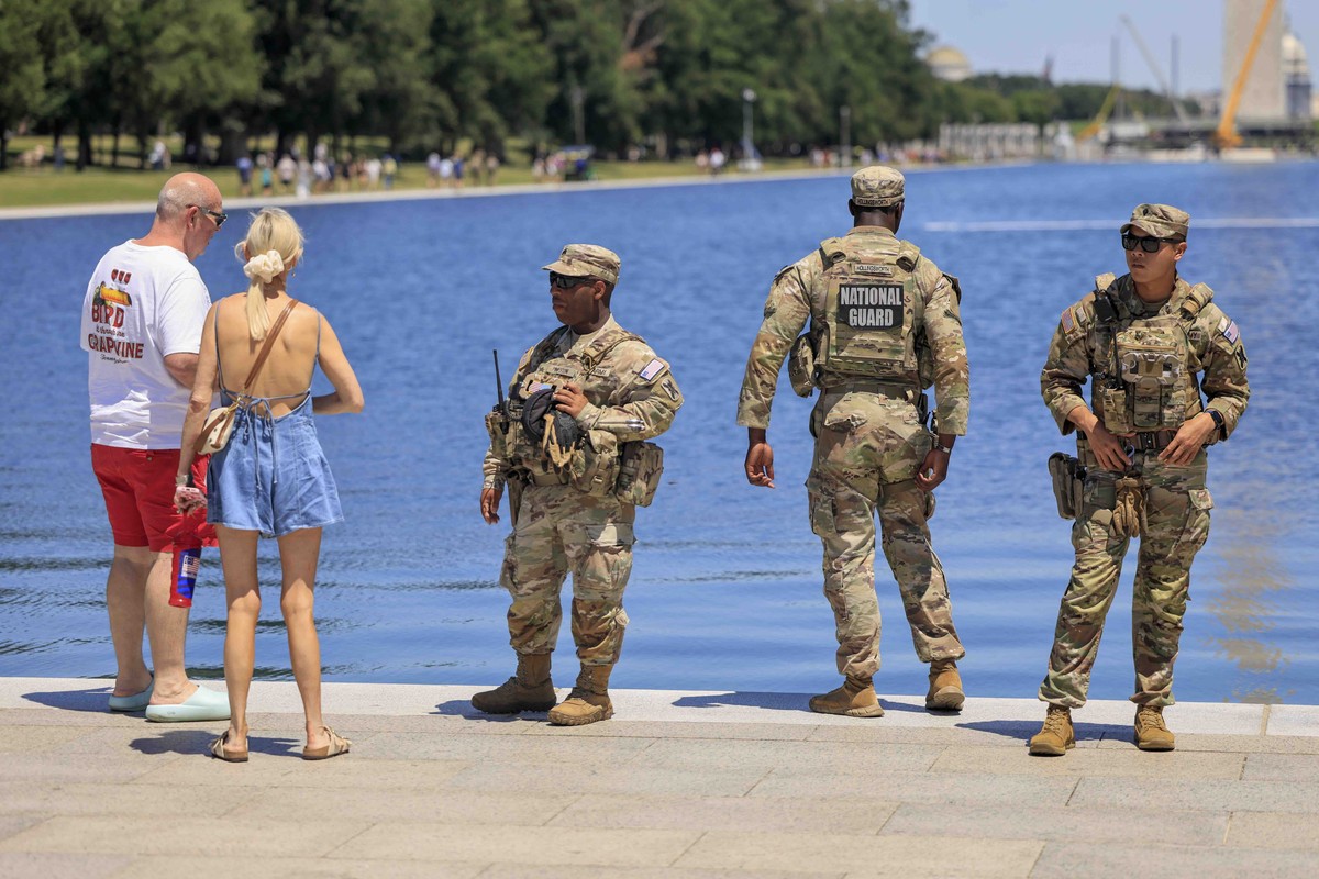 epa13061696 National Guard soldiers patrol the newly renovated Lincoln Memorial Reflecting Pool on the National Mall in Washington, DC, USA, 24 June 2026. US President Trump said the pool will likely  ...