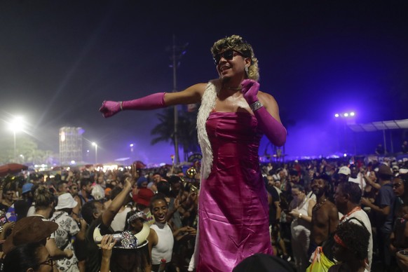 A fan dances while waiting for the start of Madonna&#039;s last show of her The Celebration Tour, on Copacabana beach in Rio de Janeiro, Brazil, Saturday, May 4, 2024. (AP Photo/Bruna Prado)