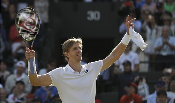 Kevin Anderson of South Africa celebrates winning his men&#039;s quarterfinals match against Switzerland&#039;s Roger Federer, at the Wimbledon Tennis Championships, in London, Wednesday July 11, 2018 ...