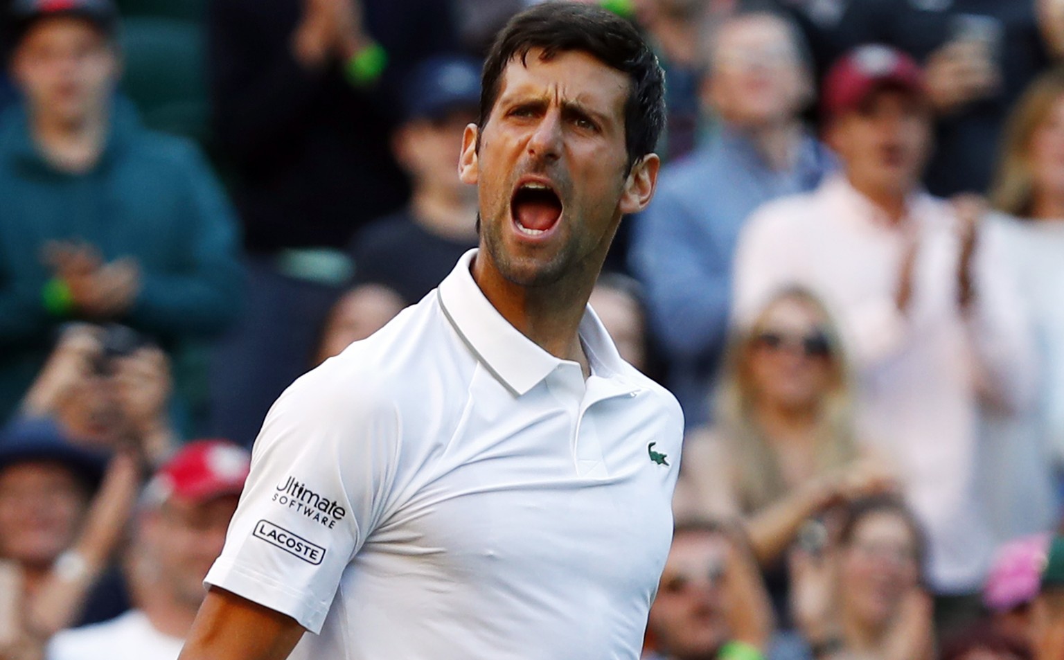 epa07692947 Novak Djokovic of Serbia celebrates his win over Denis Kudla of USA in their second round match during the Wimbledon Championships at the All England Lawn Tennis Club, in London, Britain,  ...
