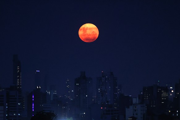 epaselect epa12793181 A full moon rises above the city in Asuncion, Paraguay, 03 March 2026. EPA/Juan Pablo Pino