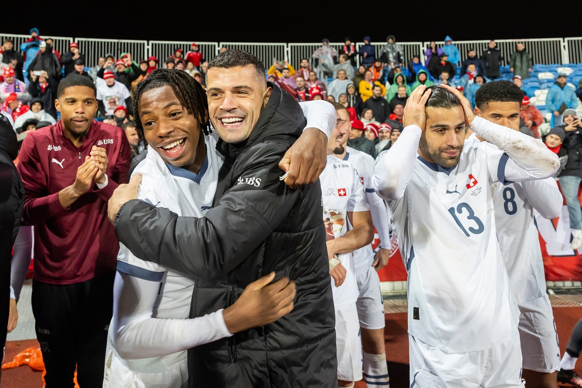 Switzerland's, from left, Johan Manzambi, Granit Xhaka and Ricardo Rodriguez, celebrates with teammates after the 2026 World Cup Group B qualifying soccer match between Kosovo and Switzerland in  ...