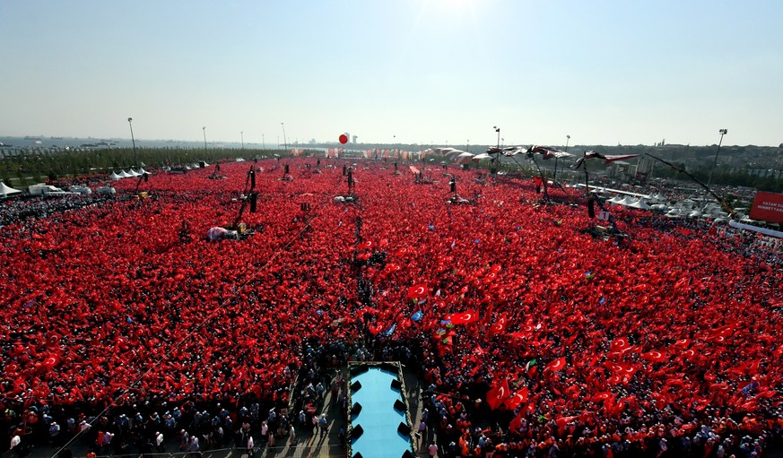 Turkish people wave flags of their country as they take part in a Democracy and Martyrs&#039; Rally in Istanbul, Sunday, Aug. 7, 2016. More than 1 million flag-waving Turks gathered in Istanbul on Sun ...