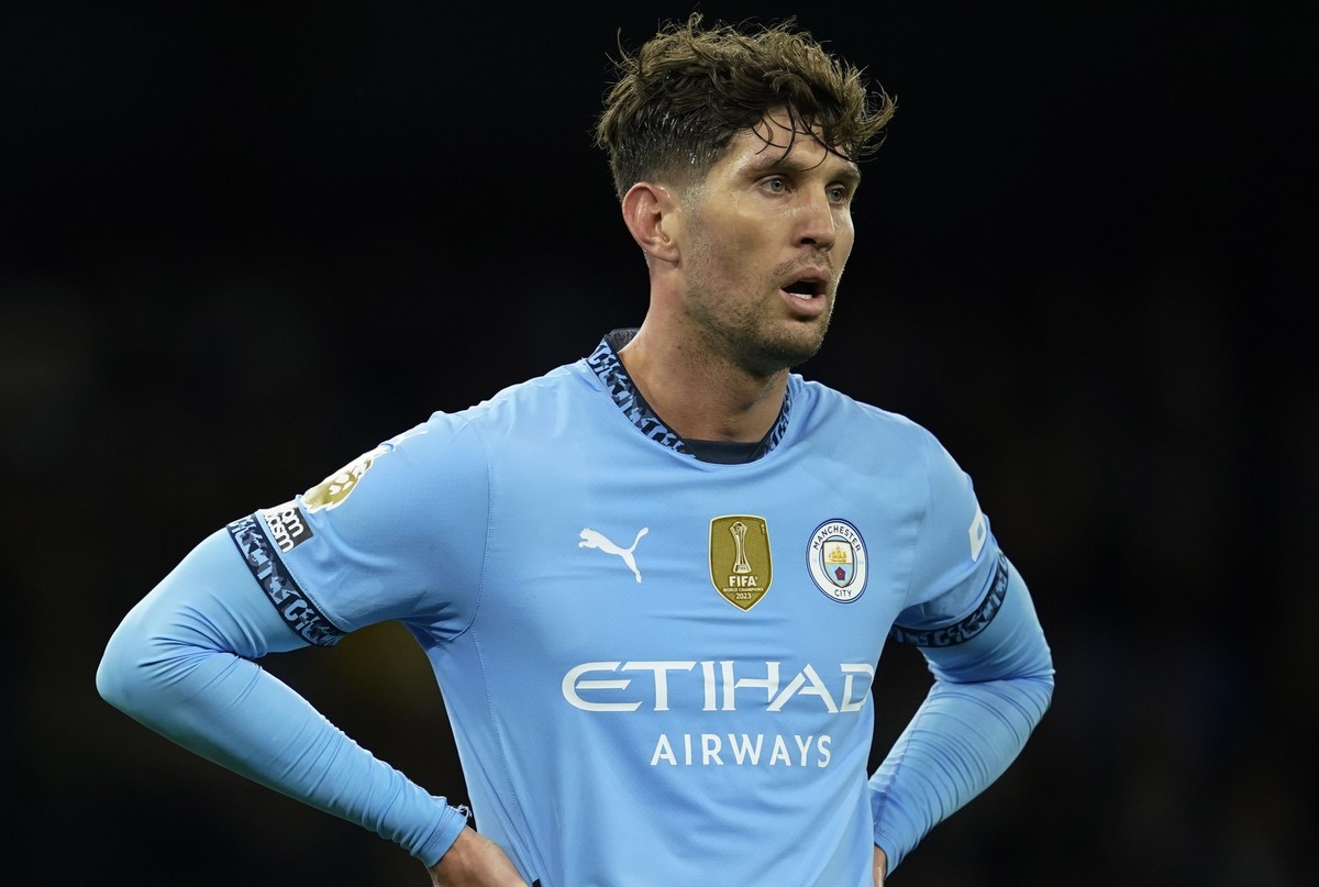 Manchester City's Manuel Akanji, left and John Stones react during the English Premier League soccer match between Manchester City and Tottenham at the Etihad Stadium in Manchester, England, Sund ...