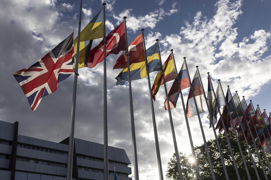 The British flag, left, flies at half mast in front of the Council of Europe, following Britain&#039;s Queen Elizabeth II&#039;s death on Thursday at the age of 96, in Strasbourg, eastern France, Frid ...