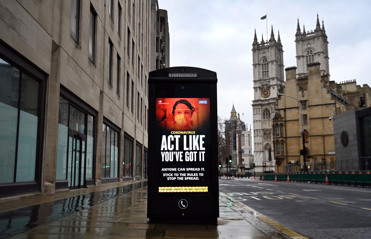 epa08951550 A coronavirus public health notice at a bus stop in London, Britain, 20 January 2021. Britain's national health service (NHS) is coming under severe pressure as Covid-19 hospital admi ...