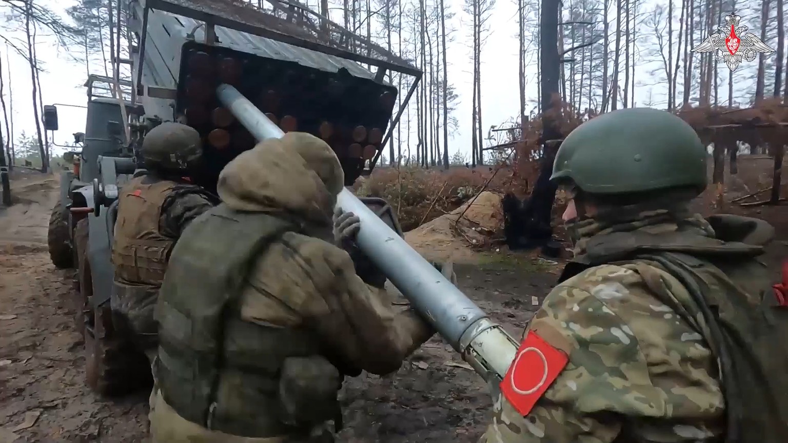 In this photo taken from video and released by Russian Defense Ministry Press Service on Thursday, Feb. 8, 2024, Russian soldiers load a rocket into a Grad rocket launcher on a mission at an undisclos ...