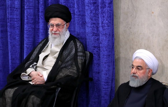 epa07570614 A handout photo made available by the Iranian Supreme Leader Office shows, Iranian Supreme Leader Ayatollah Ali Khamenei and Iranian President Hassan Rouhani during a ceremony in Tehran, I ...