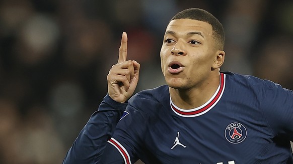 epa09639228 Paris Saint Germain's Kylian Mbappe celebrates scoring a goal after a penalty kick during the Ligue 1 match between Paris Saint Germain and AS Monaco in Paris, France, 12 December 202 ...