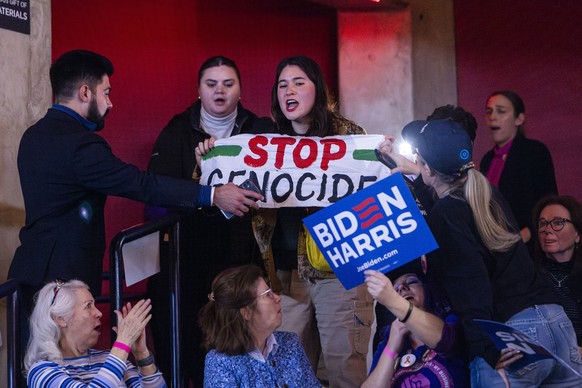 epa11099802 A pro-Palestinian protester interrupts US President Joe Biden (unseen) at a campaign rally for abortion rights at George Mason University in Manassas, Virginia, USA, 23 January 2024. The r ...