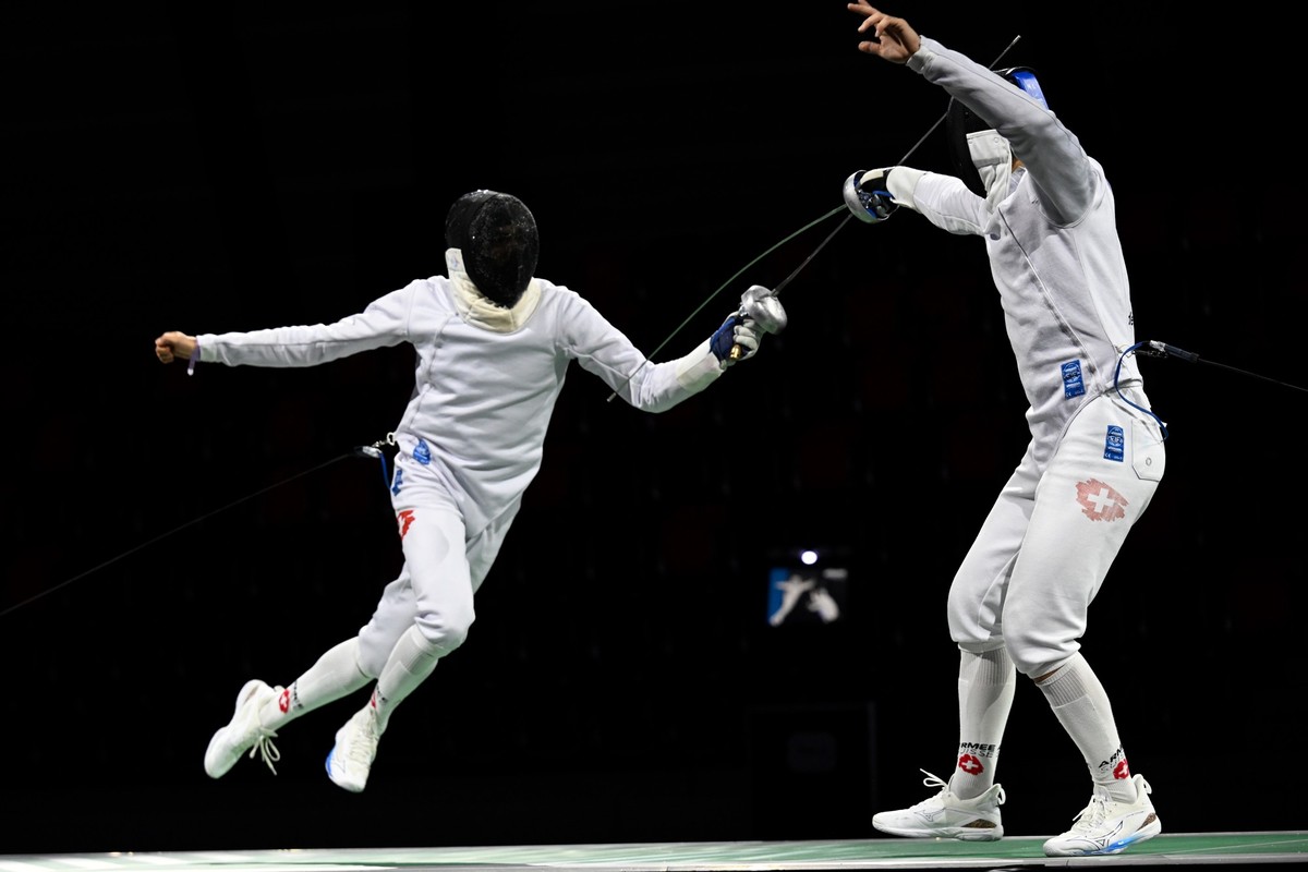Lucas Malcotti of Switzerland, right, in action against Alexis Bayard of Switzerland, at the Final during the fencing Berne world cup tournament in Guemligen, Switzerland, Saturday, November 11, 2023. ...