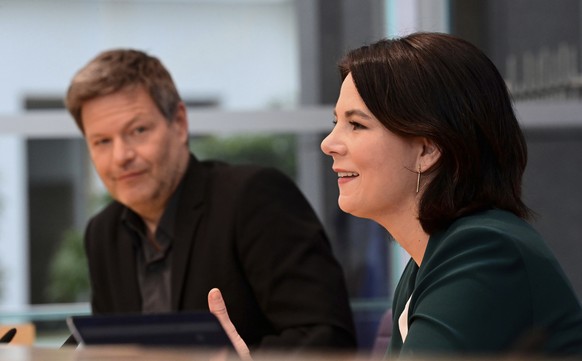 FILE - In this Monday, March 15, 2021 file photo, the leaders of Germany&#039;s Green party Annalena Baerbock, right, and Robert Habeck attend a press conference in Berlin, Germany. On Monday, April 1 ...