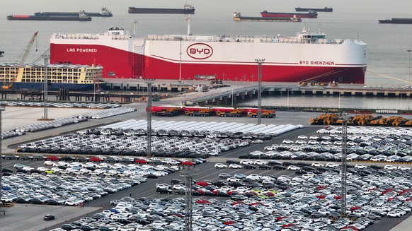 epa12059962 The brand new BYD Shenzhen ro-ro (roll-on/roll-off) ship, with 9,200 standard car parking slots, prepares for her maiden voyage to Brazil, after being loaded with over 7,000 BYD electric c ...
