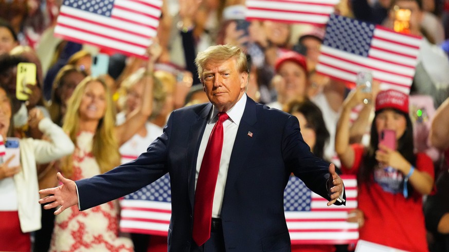 President Donald Trump greets supporters as he arrives on the stage at the Republican convention Thursday, Sept. 10, 2026, in Dallas. (AP Photo/Julio Cortez)
JD Vance Donald Trump