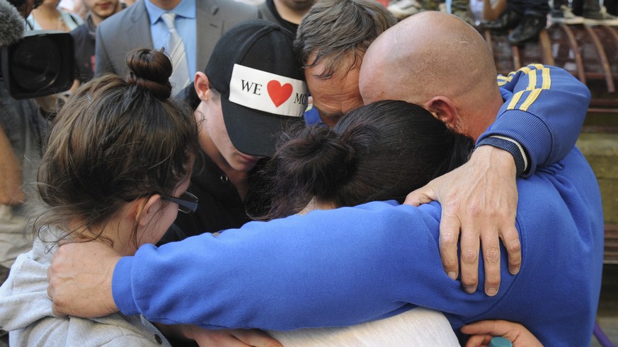 Olivia Campbell&#039;s mother Charlotte Campbell, and stepfather Paul Hodgson, gesture with friends as they pay tribute to her and the other victims of the explosion outside Manchester Arena, at St An ...