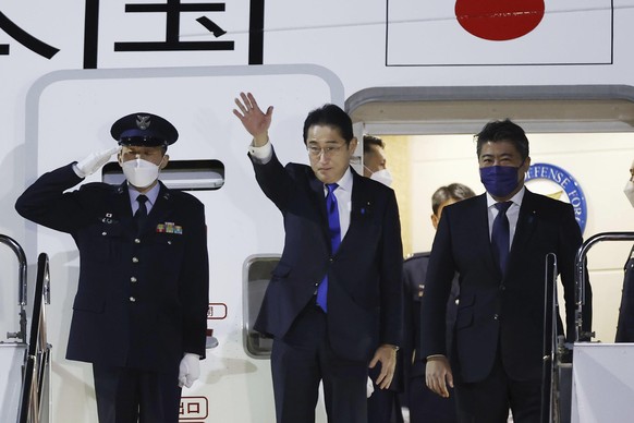 Japanese Prime Minister Fumio Kishida, center, prepares to leave Tokyo's Haneda Airport on Sunday, January 8, 2023. Kishida will embark on a week-long journey Monday to strengthen military ties with Europe and Britain...