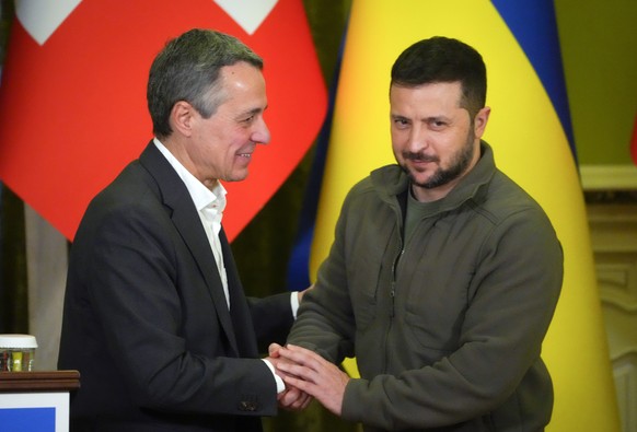 Ukrainian President Volodymyr Zelenskyy, right, shakes hands with Swiss President Ignazio Cassis in Kyiv, Ukraine, Thursday, Oct. 20, 2022. (AP Photo/Efrem Lukatsky)