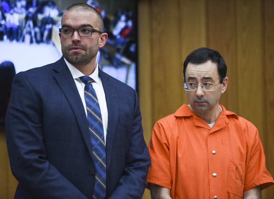 Larry Nassar appears in Judge Janice Cunningham&#039;s courtroom with his attorney Matt Newburg, Wednesday, Jan. 31, 2018, for the first day of victim impact statements in Eaton County Circuit Court i ...