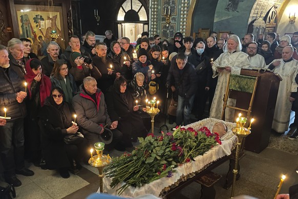 Relatives and friends pay their last respects at the coffin of Russian opposition leader Alexei Navalny in the Church of the Icon of the Mother of God Soothe My Sorrows, in Moscow, Russia, Friday, Mar ...