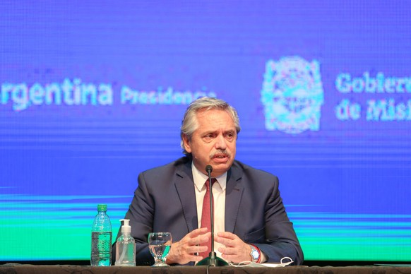 epa08769227 A handout photograph made available by Argentina&#039;s Presidential Office shows Argentine president Alberto Fernandez speaking at a press conference in Misiones, Argentina, 23 October 20 ...