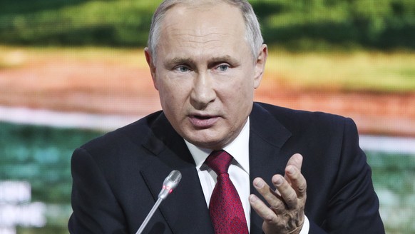 Russian President Vladimir Putin gestures as he addresses at the Eastern Economic Forum in Vladivostok, Russia, Wednesday, Sept. 12, 2018. (Sergei Bobylevl/TASS News Agency Pool Photo via AP)