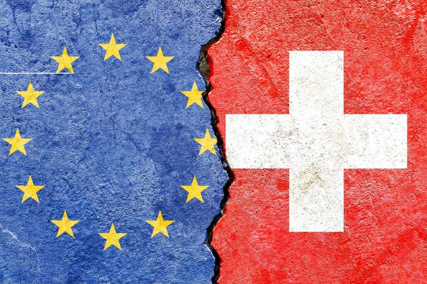 EU (European Union) VS Swiss national flags icon on old broken weathered cracked concrete wall background, abstract design Europe Switzerland politics relationship conflicts concept texture wallpaper