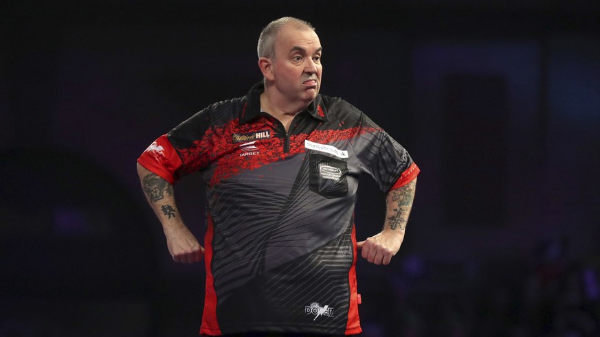 England&#039;s Phil Taylor reacts during his quarterfinal match against Scotland&#039;s Gary Anderson on day thirteen of the World Darts Championship at Alexandra Palace, London, Friday Dec. 29, 2017. ...