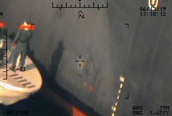 epa07654763 A handout photo made available by the US Department of Defense (DoD) shows Imagery taken from a US Navy MH-60R helicopter of the Islamic Revolutionary Guard Corps Navy after removing an un ...