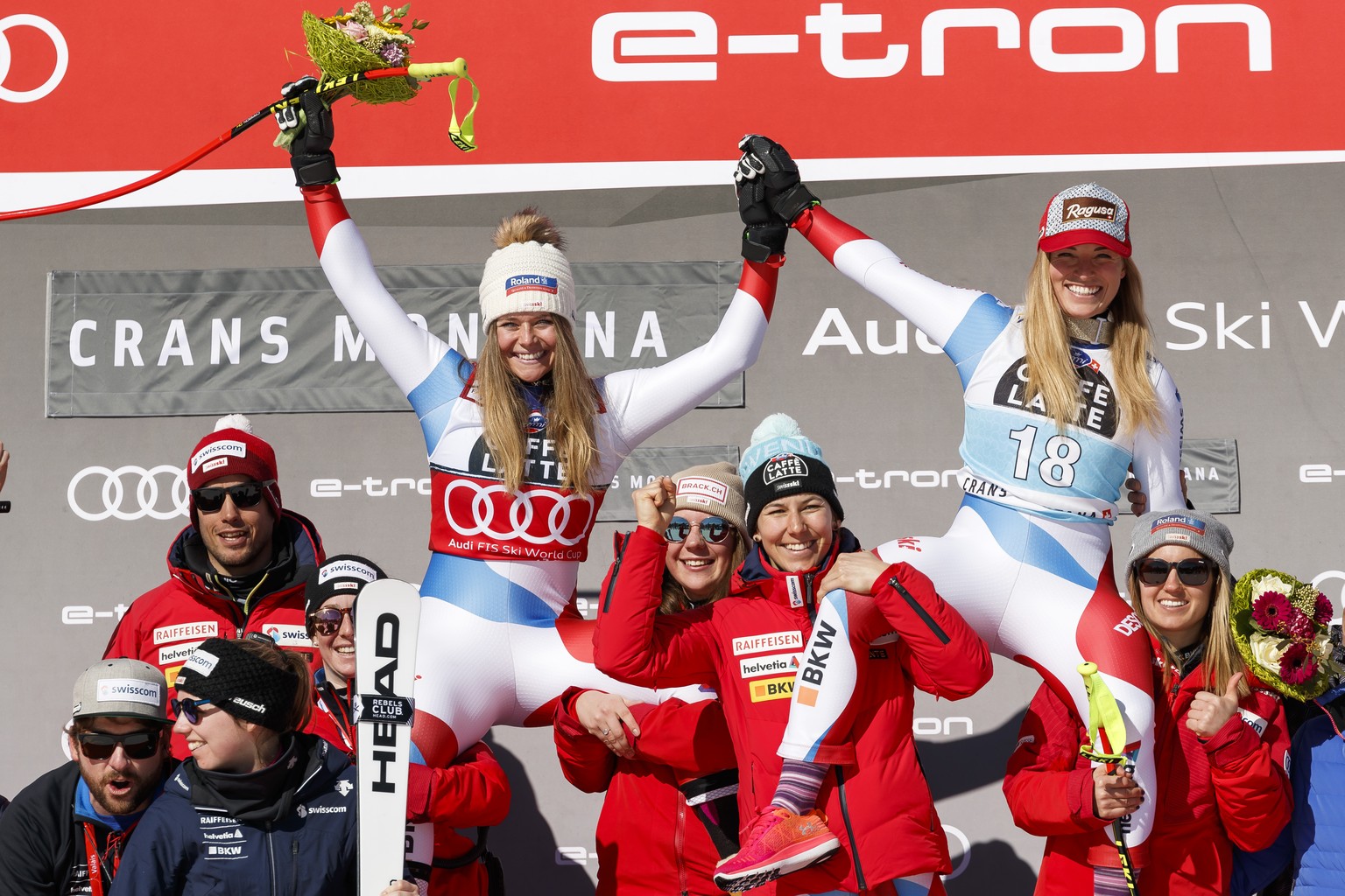 From left, Corinne Suter of Switzerland and Lara Gut-Behrami of Switzerland on the podium after the women&#039;s Downhill race of the FIS Alpine Ski World Cup season in Crans-Montana, Switzerland, Fri ...