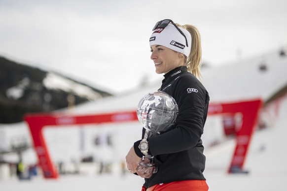 Lara Gut-Behrami of Switzerland poses with the women&#039;s giant slalom overall leader crystal globe trophy in the finish area during the second run of the women&#039;s giant slalom race at the FIS A ...