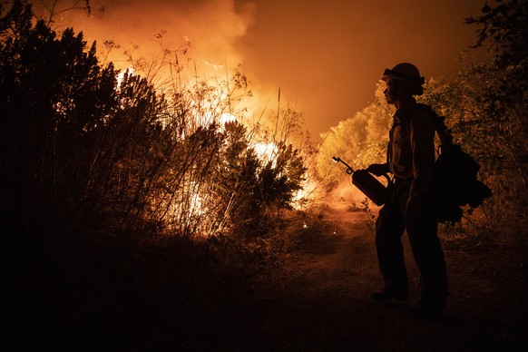 epa07964257 A firefighter works at containing the Maria fire spreading in the hills near Ventura, North West of Los Angeles, California, USA, 01 November 2019. Media reports say that the fire that bro ...