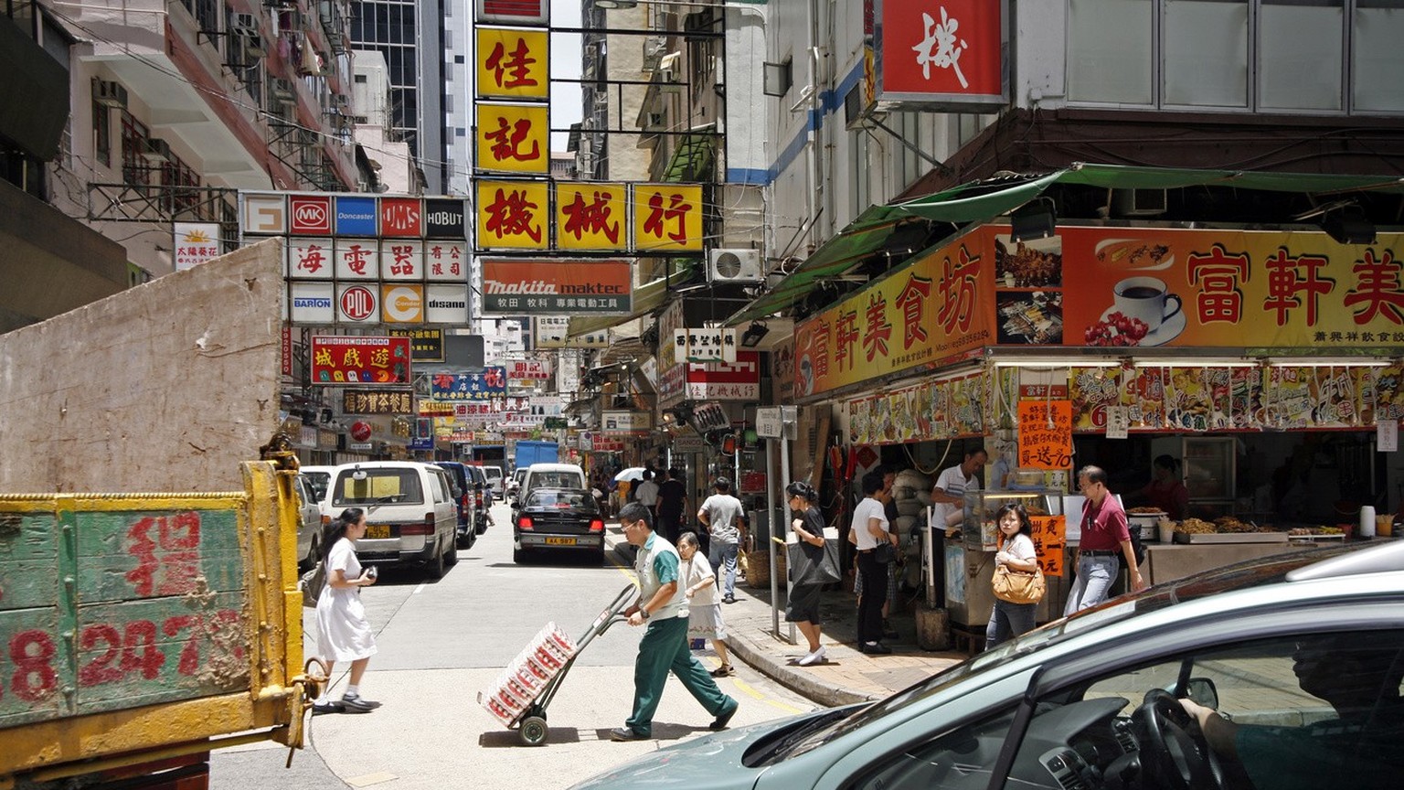 Street life is busy in downtown Hong Kong, China, Saturday July 7, 2007. Hong Kong, officially the Hong Kong Special Administrative Region, is one of the two special administrative regions of the Peop ...
