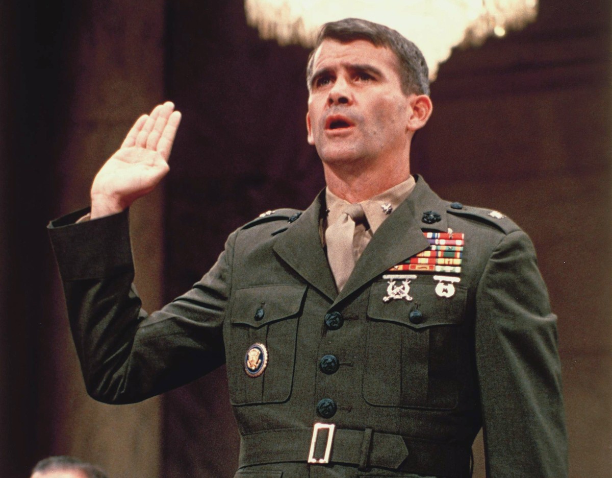 FILE - In this July 7, 1987, file photo, Lt. Col. Oliver North is sworn in before the Iran Contra Committee prior to his testimony in Washington. Washington knows how to do big hearings. Dramatic cong ...