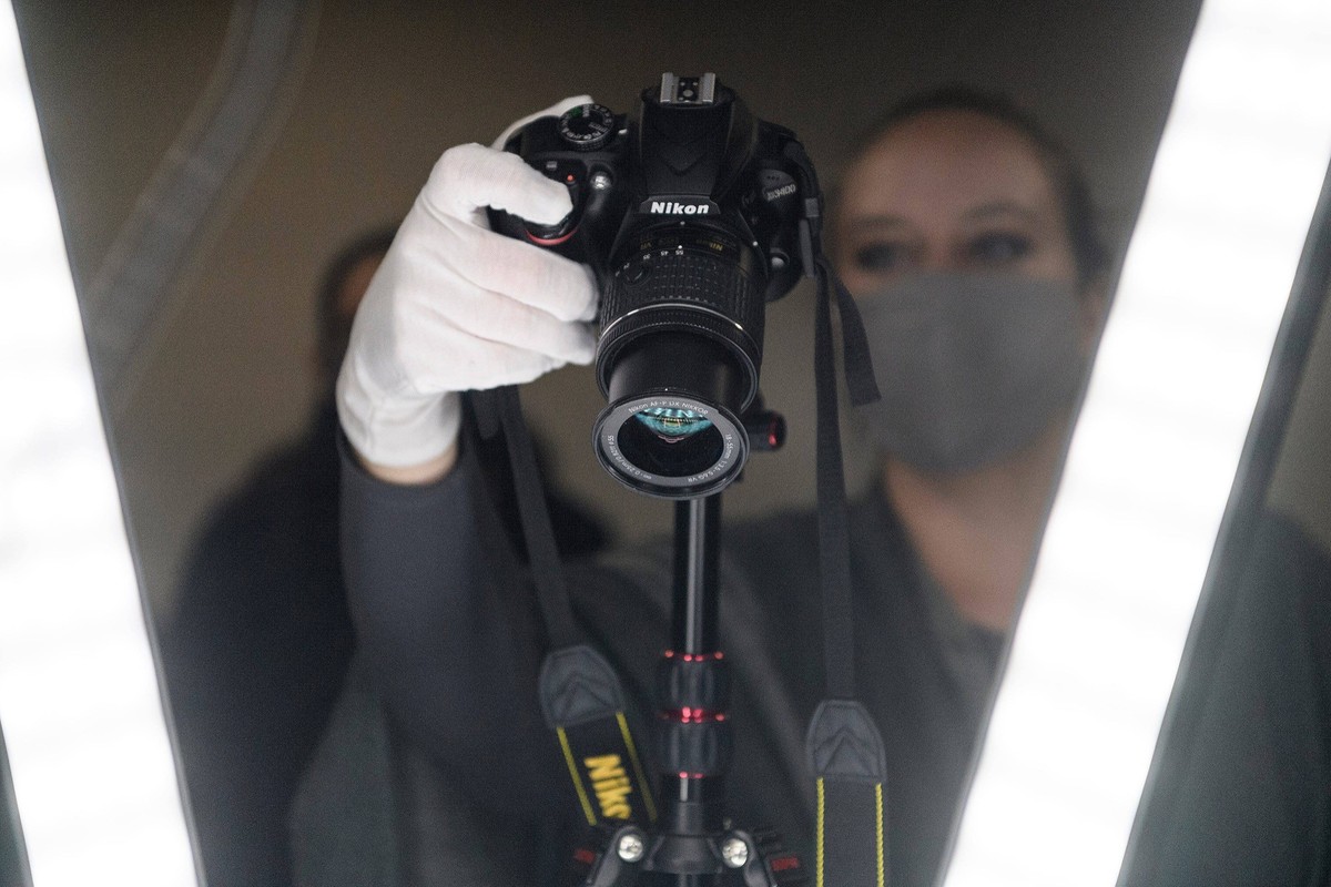 Syndication: Evansville Courier and Press Dr. Meg Hagseth teaches two archeology students, Shauna Mihalyo and Mary Butler, how to set up a camera to create photogrammetry of a Byzantine period clay oi ...