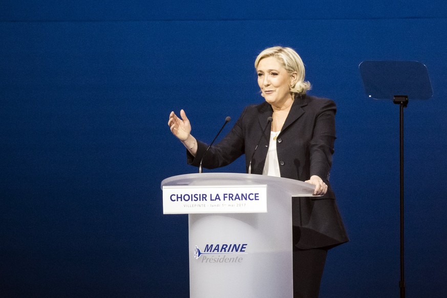 epa05938500 Far-right Front National (FN) party candidate Marine Le-Pen delivers a speech during a meeting in Villepinte, north of Paris, France, 01 May 2017. Far-right Front National (FN) party candi ...