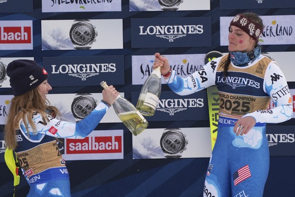 United States' Mikaela Shiffrin, left, and United States' Breezy Johnson, celebrate on the podium after winning the gold medal in a women's team combined event, at the Alpine Ski World ...