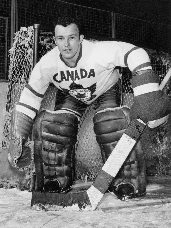 Orig. caption... Kitchener, Ontario Jan 14 1955. FIRST LINE GOAL KEEPER... of Canada s Olympic Hockey team going to Cortina Italy is Denis Brodeur seen defending his goal. Note D Brodeur, b. 1930, Can ...