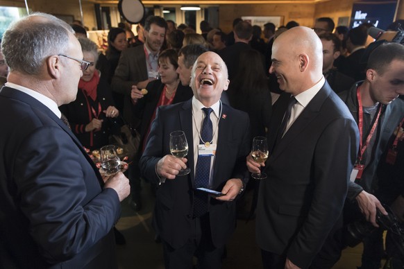 From left, Swiss Federal Councillor Guy Parmelin, Swiss Federal President Ueli Maurer and Swiss Federal Councillor Alain Berset smiles during the opening of The House of Swiitzerland, HOS, in the Vail ...
