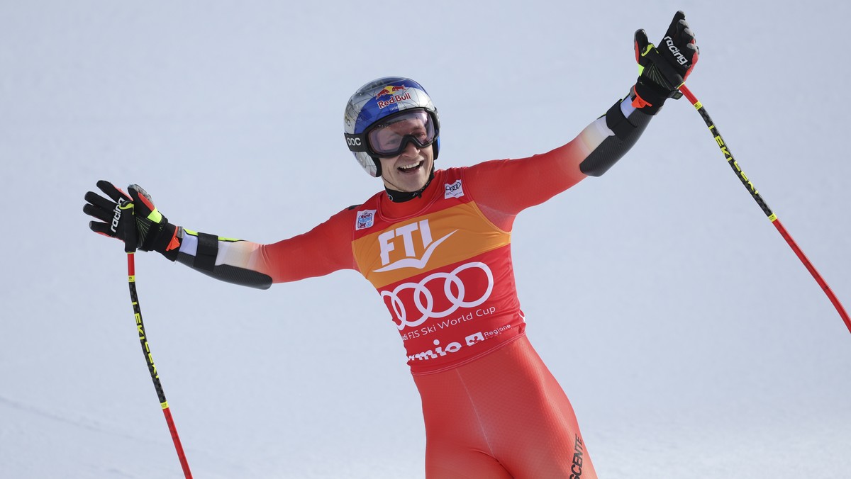 Switzerland's Marco Odermatt celebrates after completing an alpine ski, men's World Cup Super G race, in Bormio, Italy, Thursday, Dec.29, 2022. (AP Photo/Alessandro Trovati)
