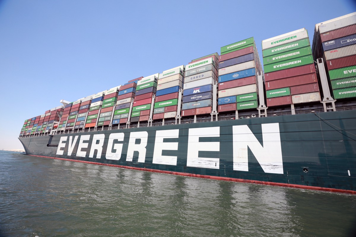 epa09328292 The container ship 'Ever Given' moves in the Suez Canal, Egypt, 07 July 2021. The Ever Given ran aground in the Suez Canal on 23 March, causing a huge traffic backlog of ships. T ...
