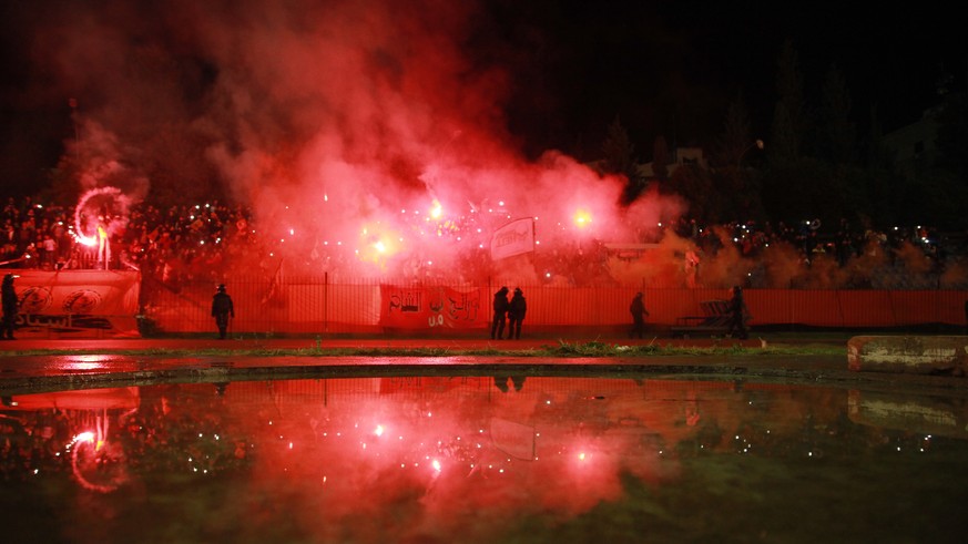 epa07185681 Supporters of the Syrian al-Wihdah soccer team cheer during the Syrian Premier League match al-Ittihad vs al-Wihdah at Tishreen Stadium in Damascus, Syria, 23 November 2018. The game came  ...