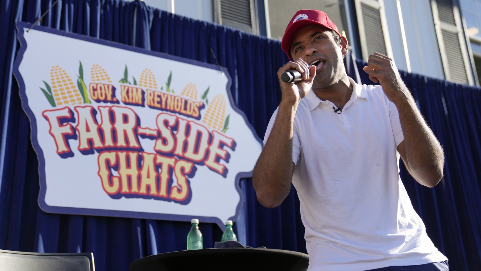 Republican presidential candidate businessman Vivek Ramaswamy sings at the end of a Fair-Side Chat with Iowa Gov. Kim Reynolds at the Iowa State Fair Saturday, Aug. 12, 2023, in Des Moines, Iowa. (AP  ...