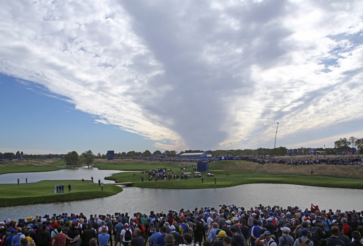 Clouds cover players and fans at the Ryder Cup at Le Golf National in Guyancourt near Paris on September 30, 2018. Team Europe defeated Team USA 17.5 to 10.5 to hand the Americans their sixth straight ...