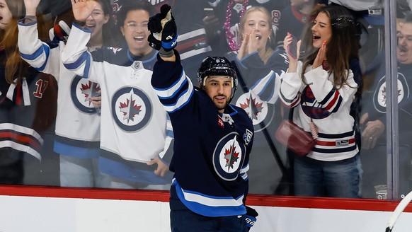 Winnipeg Jets&#039; Nino Niederreiter (62) celebrates his goal against the Nashville Predators during the first period of an NHL hockey game in Winnipeg, Manitoba, on Saturday, October 18, 2025. (John ...