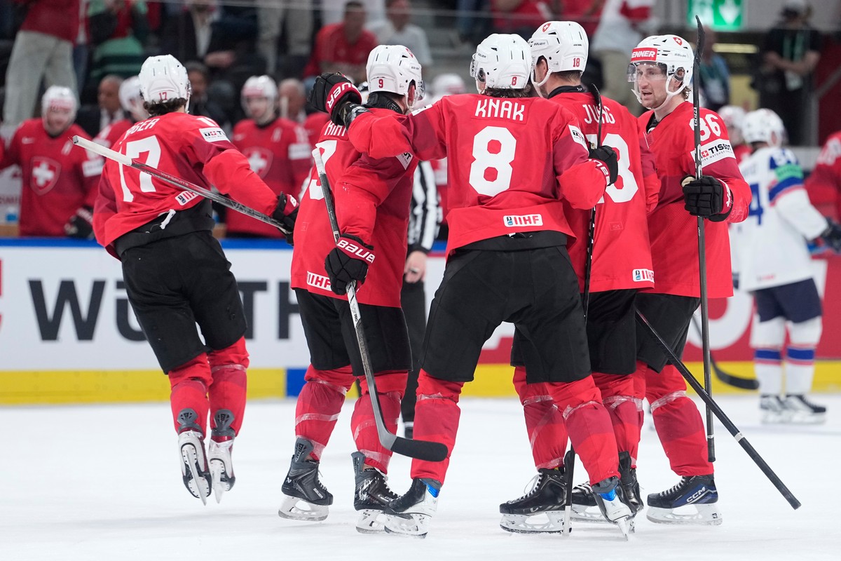 Switzerland's Jonas Siegenthaler (17) celebrates after scoring his side's third goal during the 2026 IIHF Men's Ice Hockey World Championship semifinal match between Switzerland and Nor ...