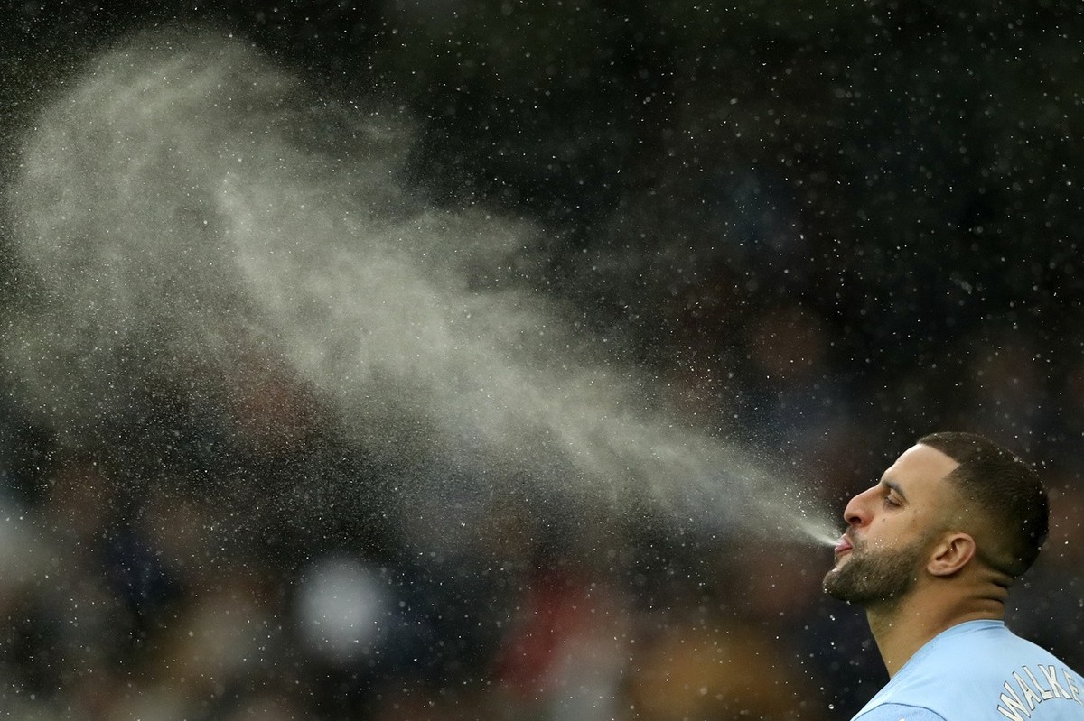 Manchester City's Kyle Walker completes his pre-match ritual of spitting water before the English Premier League soccer match between Manchester City and West Ham United at the Etihad stadium in  ...