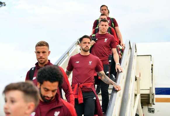 epa06760947 A handout photo made available by the UEFA of Liverpool players (L-R) Jordan Henderson, Danny Ings, and James Milner arriving ahead of the UEFA Champions League final at IEV Airport in Kie ...