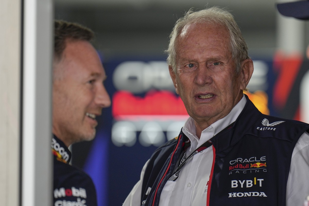 Helmut Marko of Red Bull Racing, right, talks with Red Bulls Team Principle Christian Horner before a practice session for the Formula One U.S. Grand Prix auto race at Circuit of the Americas, Saturda ...