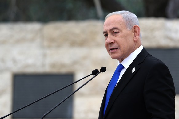 FILE - Israel's Prime Minister Benjamin Netanyahu attends a ceremony at the Military Cemetery on Mount Herzl in Jerusalem, April 21, 2026. (Ilia Yefimovich/Pool Photo via AP, File)
Israel Politic ...