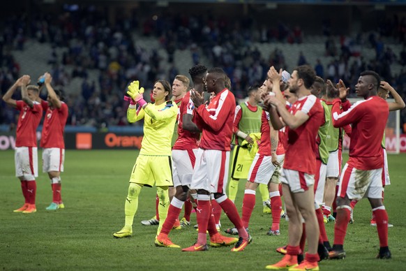 Swiss players cheer their supporters, after the UEFA EURO 2016 group A preliminary round soccer match between Switzerland and France, at the Pierre Mauroy stadium, in Villeneuve-d&#039;Ascq near Lille ...